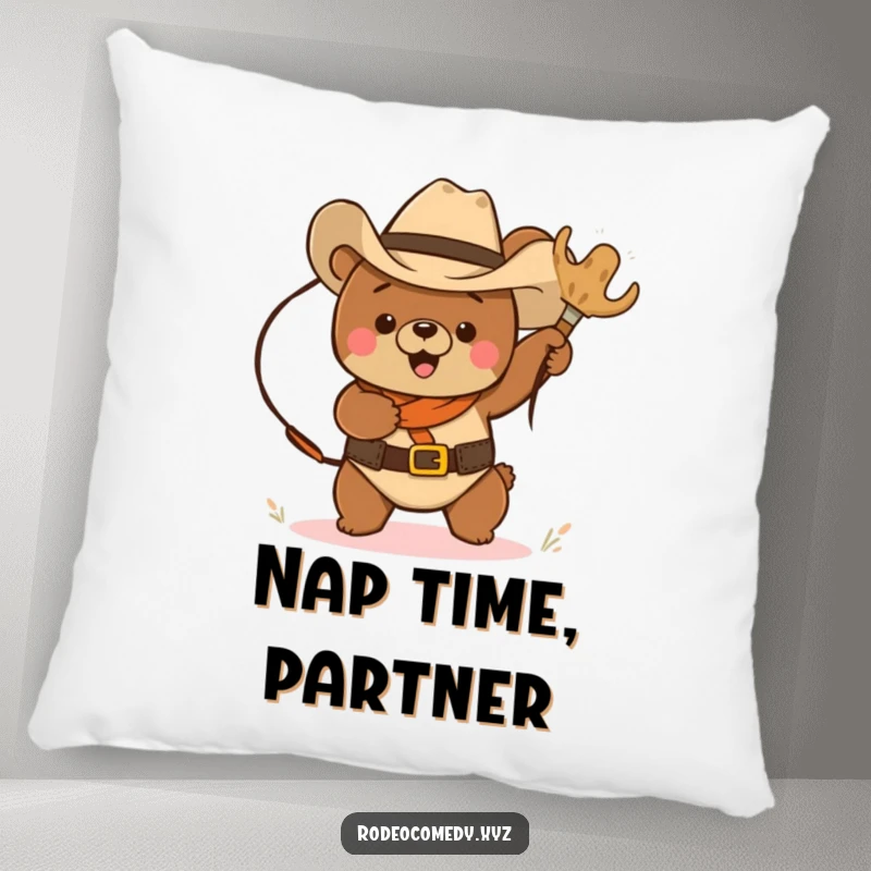Funny cowboy bear trying to lasso a tumbleweed, printed on a soft, decorative pillow, adding humor to any room.