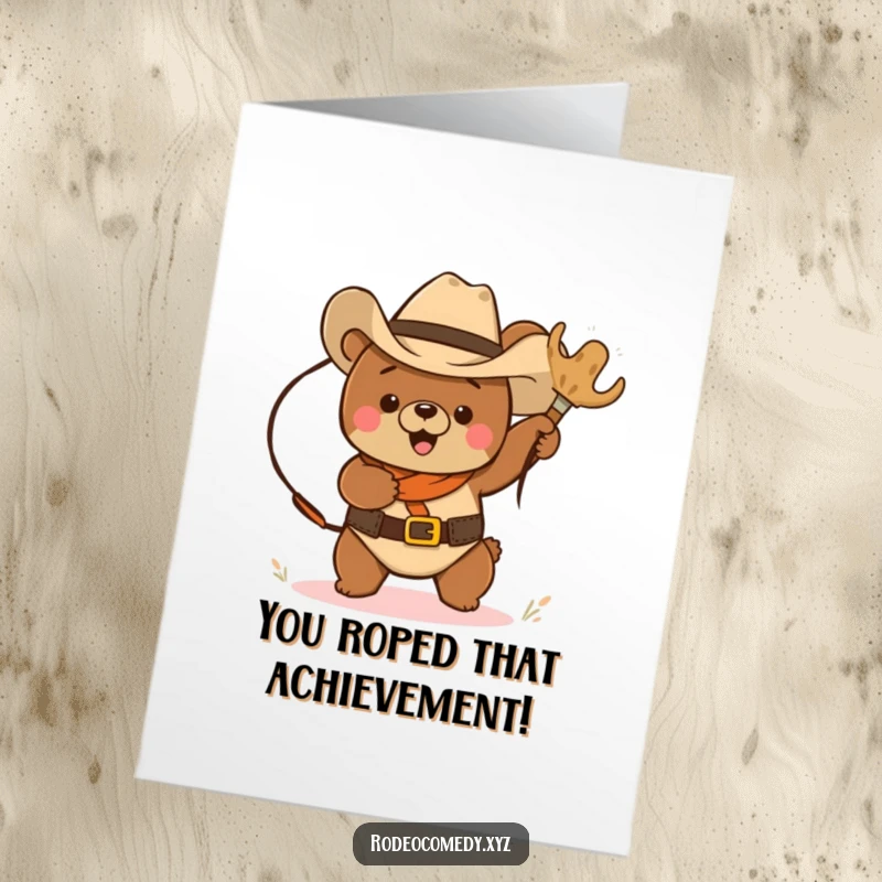 Funny Free Printable Congrats Card: Cowboy bear in hat lassoing a tumbleweed, celebrating achievements with Western humor.