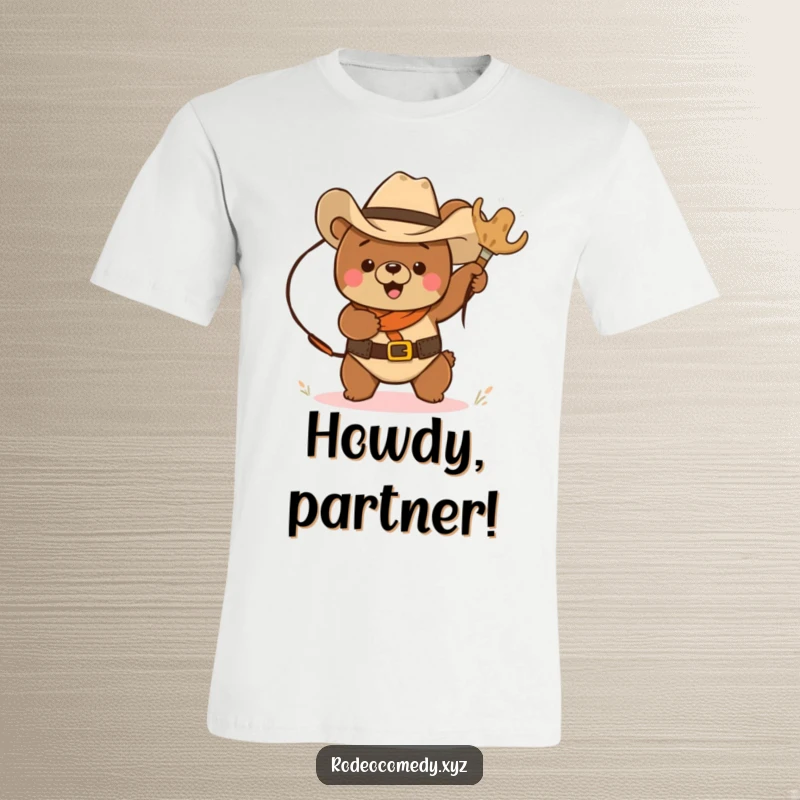 Funny brown bear wearing a cowboy hat, lassoing a bouncing tumbleweed in a humorous western scene on a t-shirt.